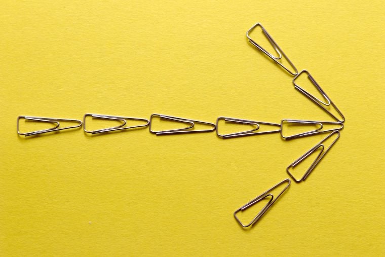 Photograph of an arrow made of paperclips